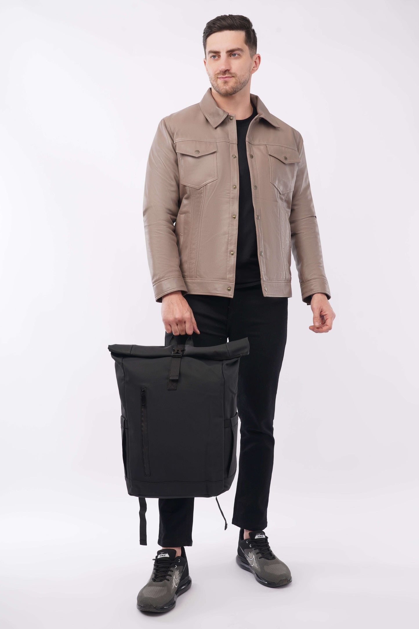 Black and white rolling backpack with anti-theft design, expandable storage, and laptop compartment up to 15.6 inches