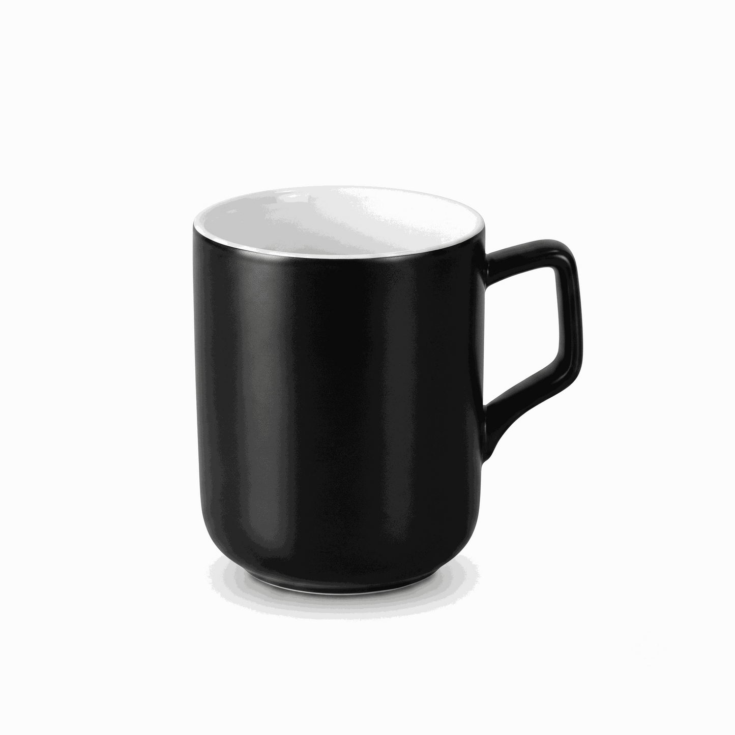 Shadow Sips coffee mug with matte black exterior and white interior made of porcelain.