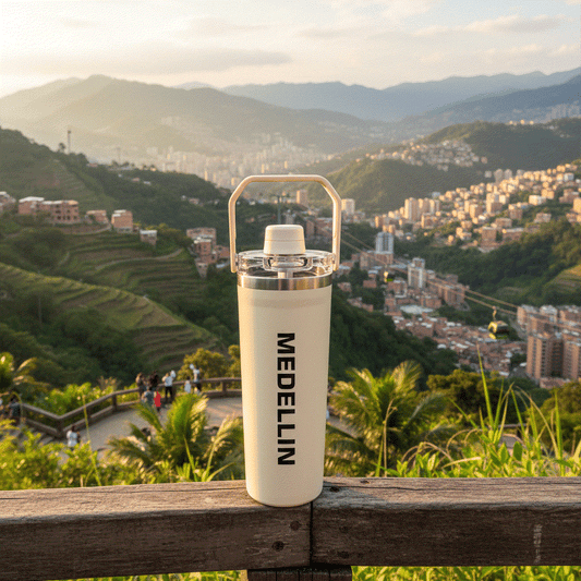 NertZ.in Travel with Nertz Edition bottle with Medellin text on a wooden railing overlooking a city