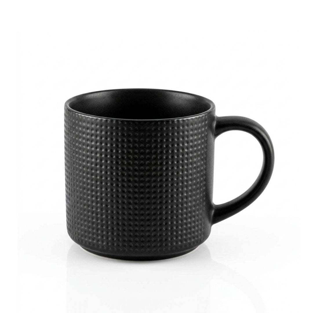 Two white porcelain criss cross coffee mugs with black patterns and handles