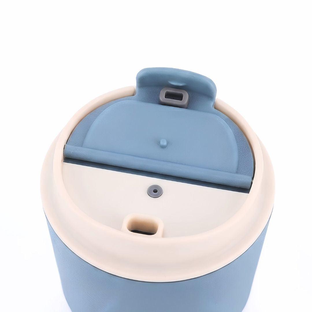 Wander Grip Mug 290ml stainless steel travel mug with lockable flip lid and fabric handle for spill-free sipping and insulation