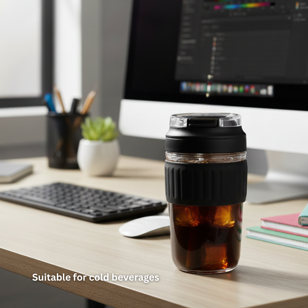 NertZ.in Crystal Grip Mug with iced coffee on a desk next to a computer