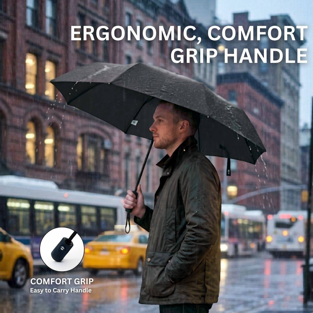 Man holding a NertZ.in Dripshield umbrella in the rain with a close-up of the comfort grip handle