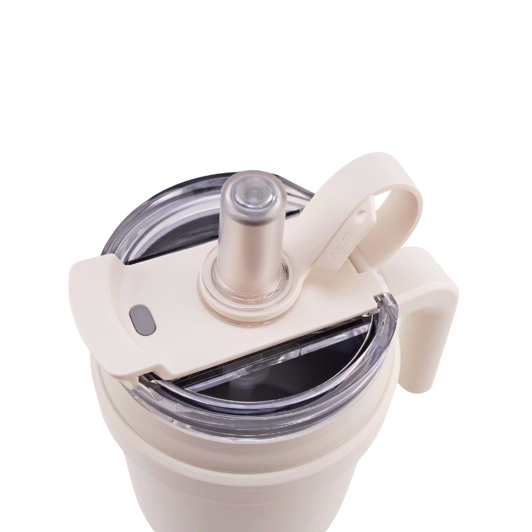 White Drive & Sip Pro stainless steel insulated water bottle with carry handle and dual lids for hot and cold drinks.