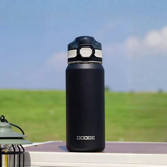 Black and beige Dodge Chill 700 stainless steel vacuum insulated water bottle with flip-open push-button lid and fabric handle