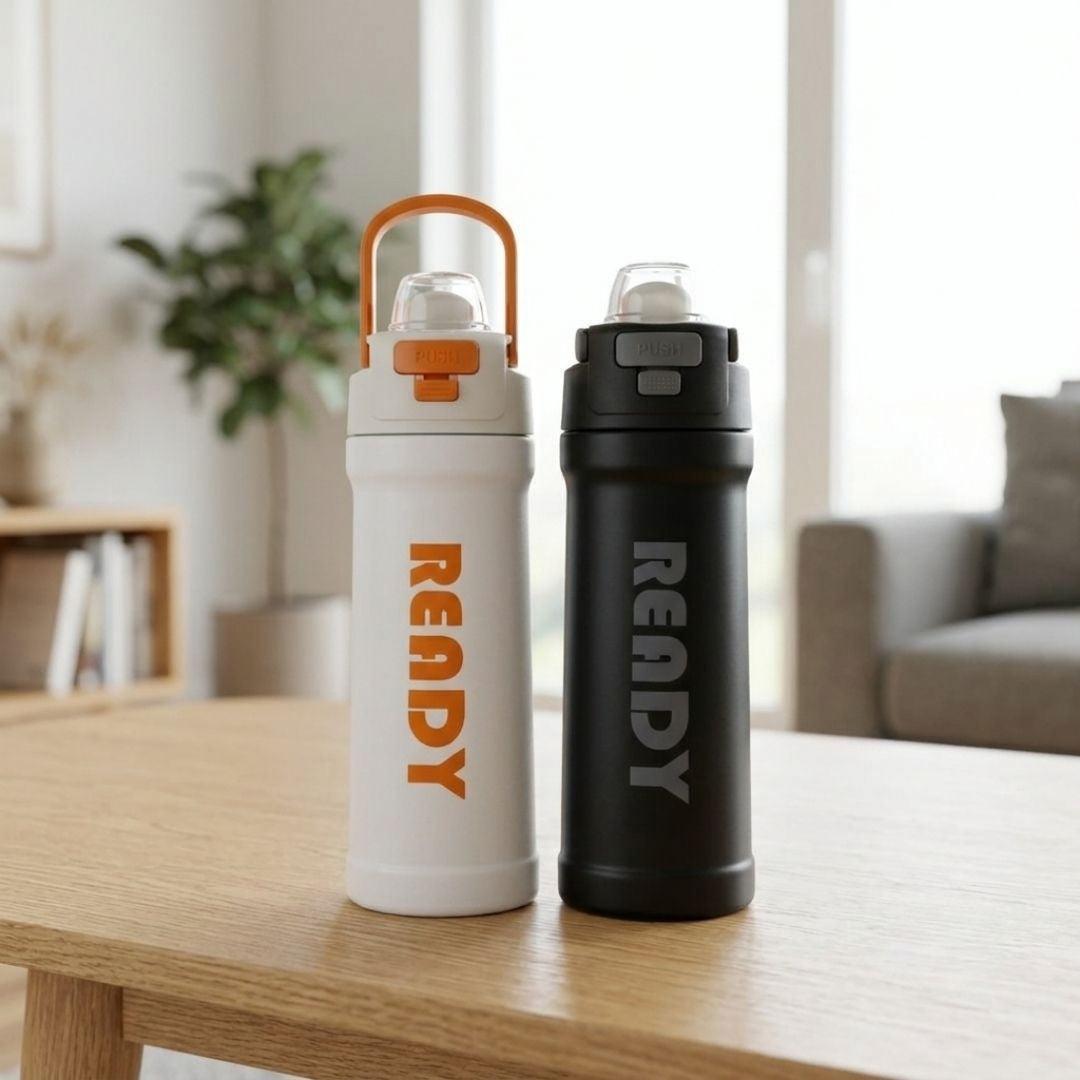 Black and white ReadyFlow bottle with flip-top lid and carry loop, double-wall vacuum insulated for temperature retention