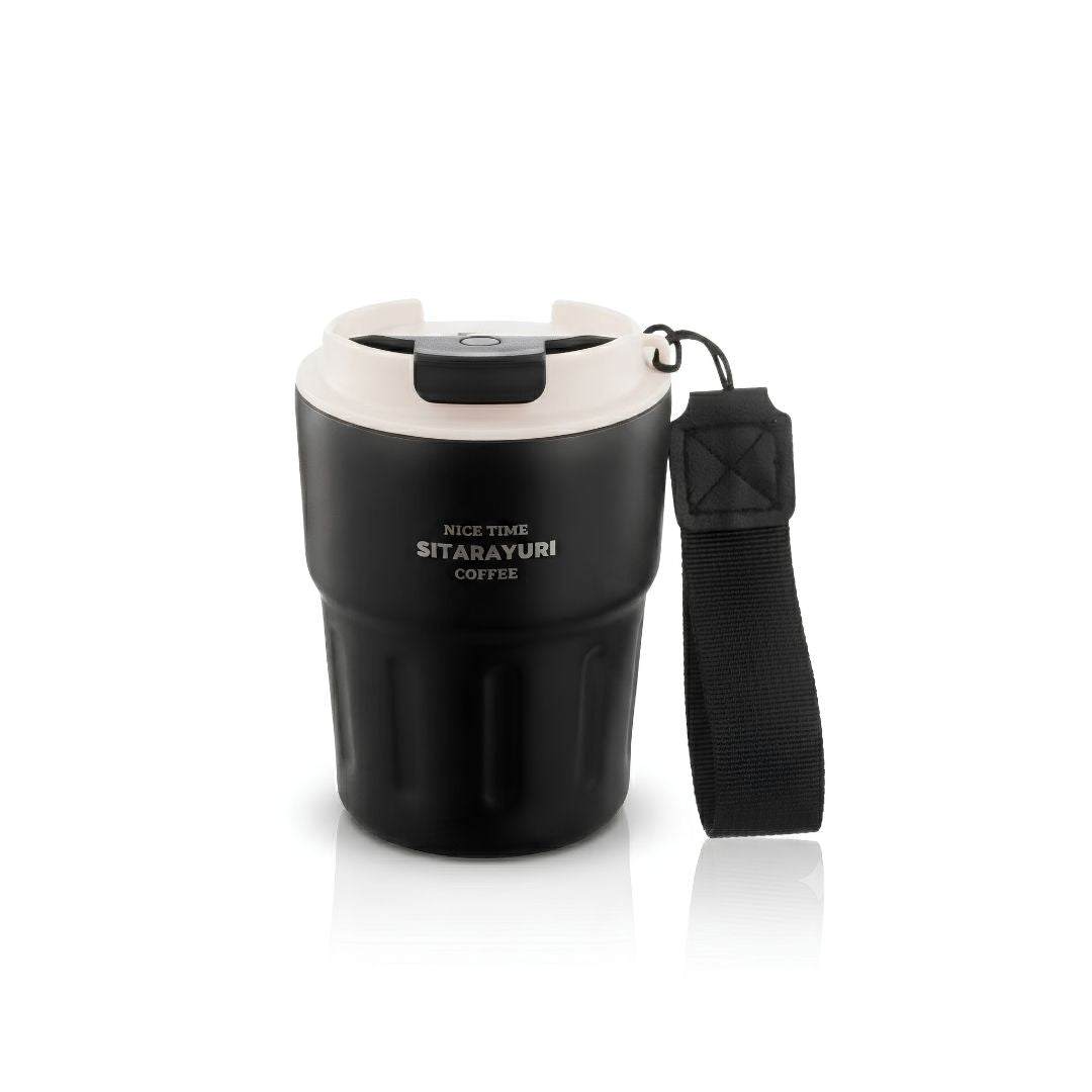 Black stainless steel Wander Grip Mug with grooved grip, flip-top lid, and fabric handle for spill-free, insulated coffee on the go