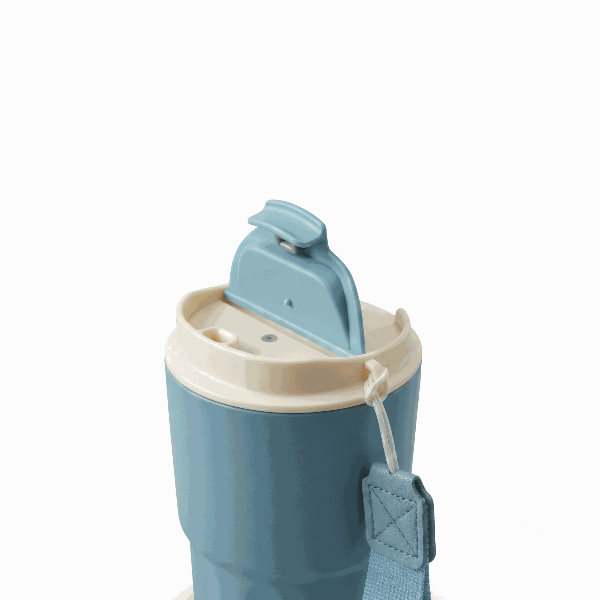Blue Wander Grip Mug Pro travel mug with grooved stainless steel body and fabric handle for insulated coffee on the go