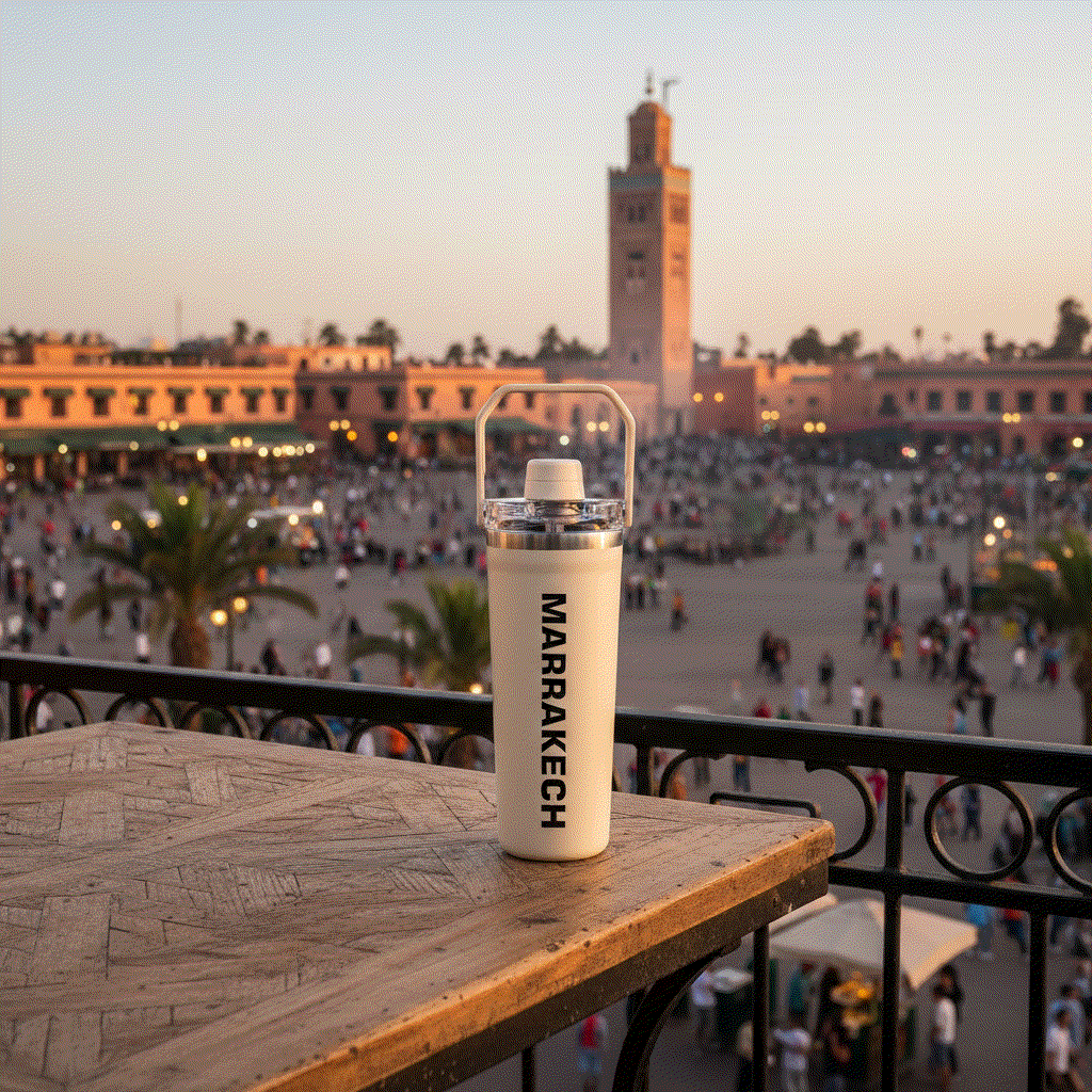 NertZ.in Travel with Nertz Edition bottle on a table overlooking a busy square in Marrakech