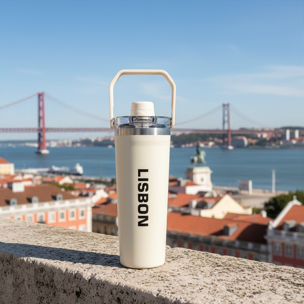 NertZ.in Travel with Nertz Edition tumbler with Lisbon text, overlooking a city and bridge